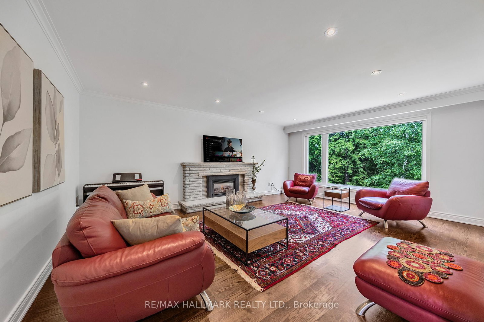 A fireplace, and a window onto the green