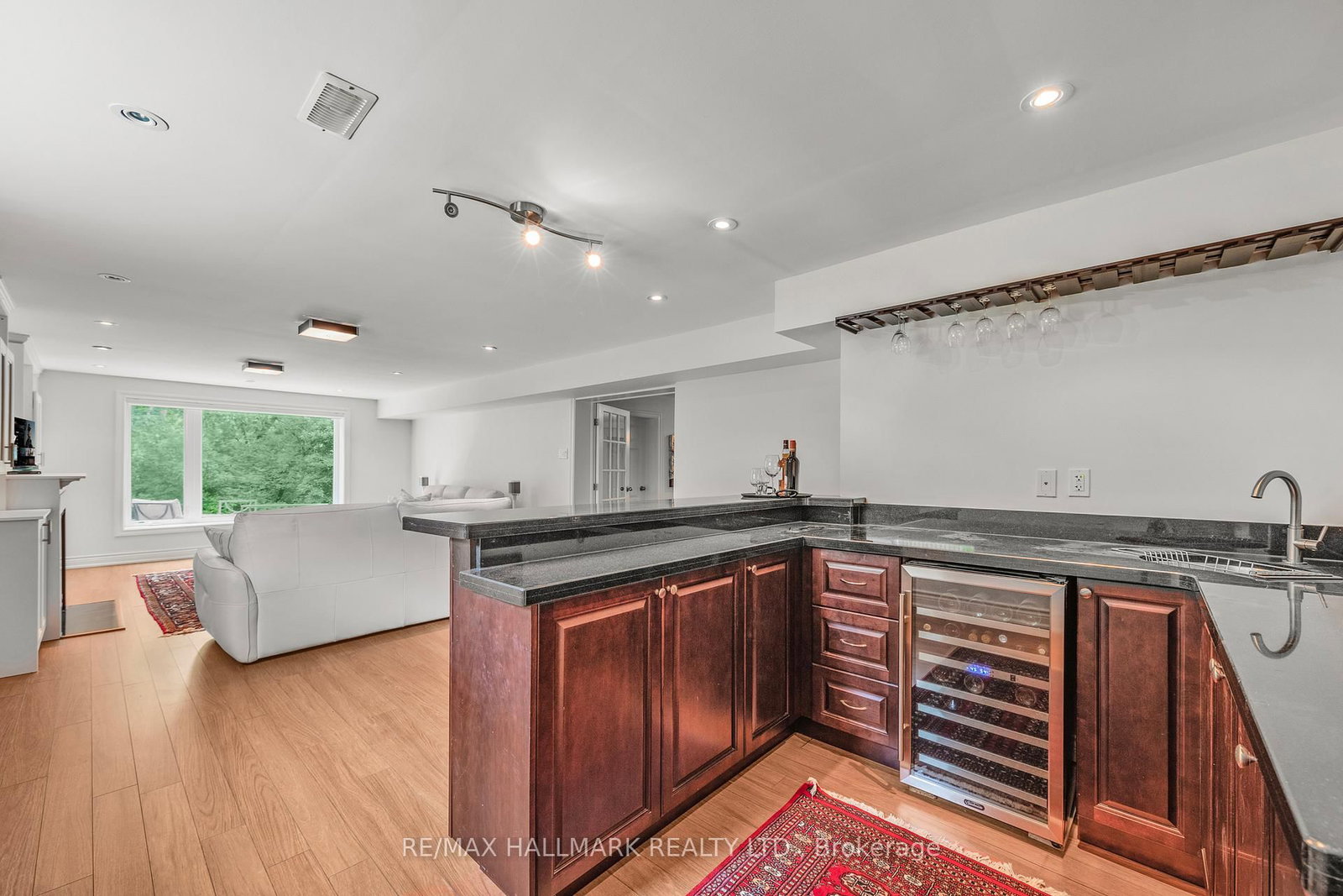 A wet bar with a wine fridge