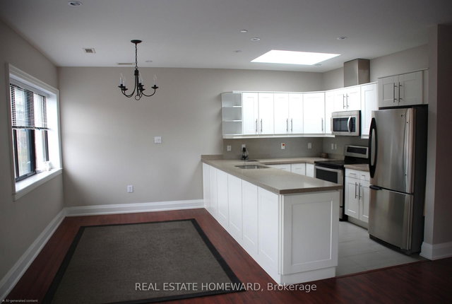 A - 425 Queen Street E