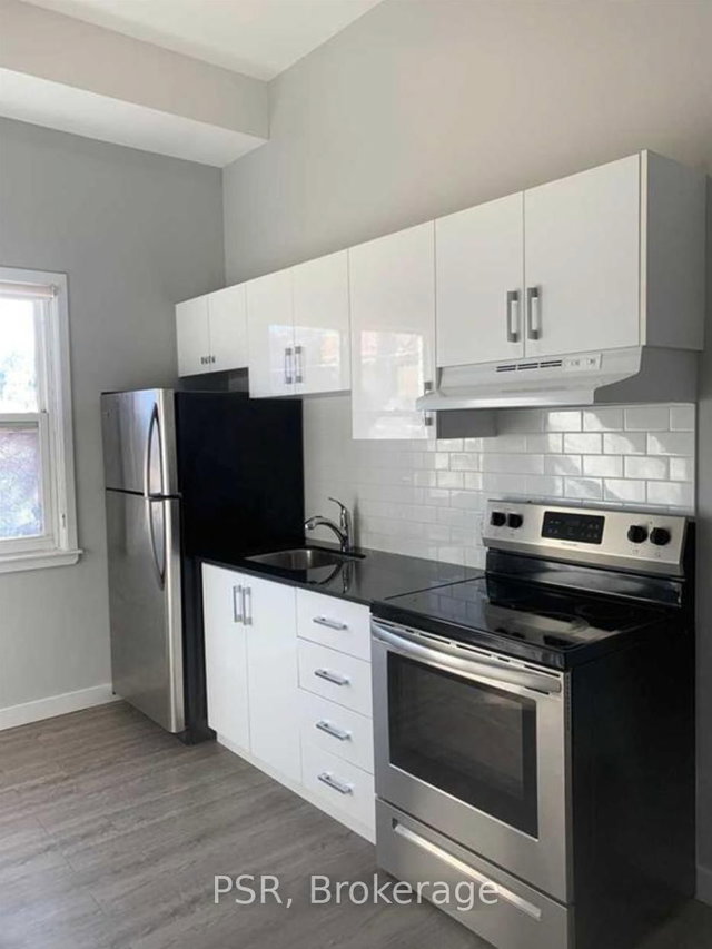 3 - 205 Gerrard Street E