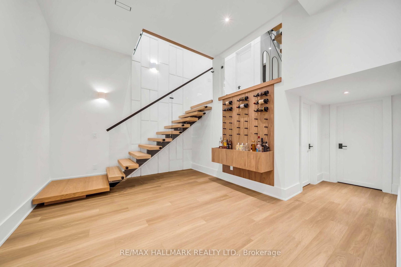 Wine racks at the foot of the stair.