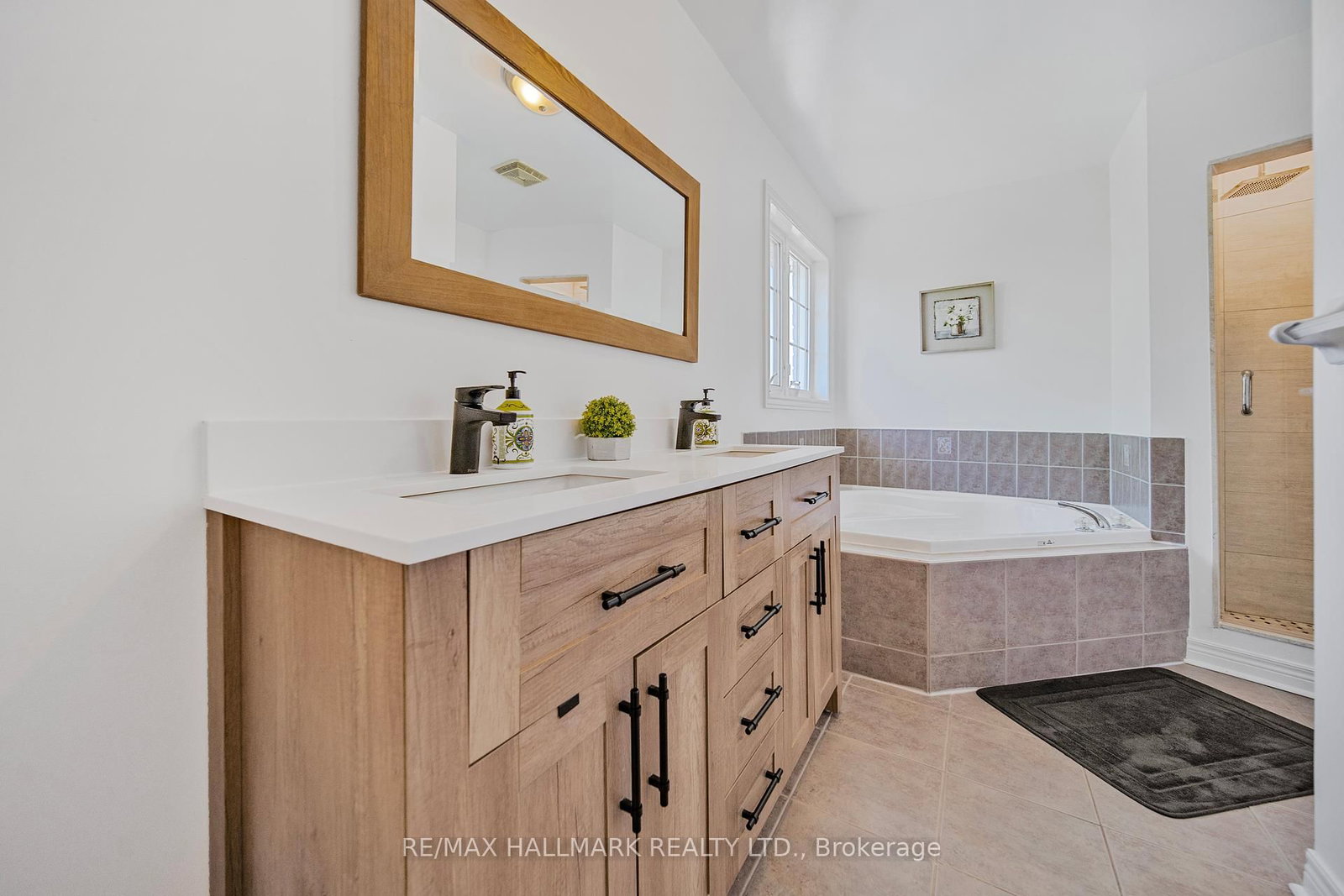 A corner tub and a glass shower