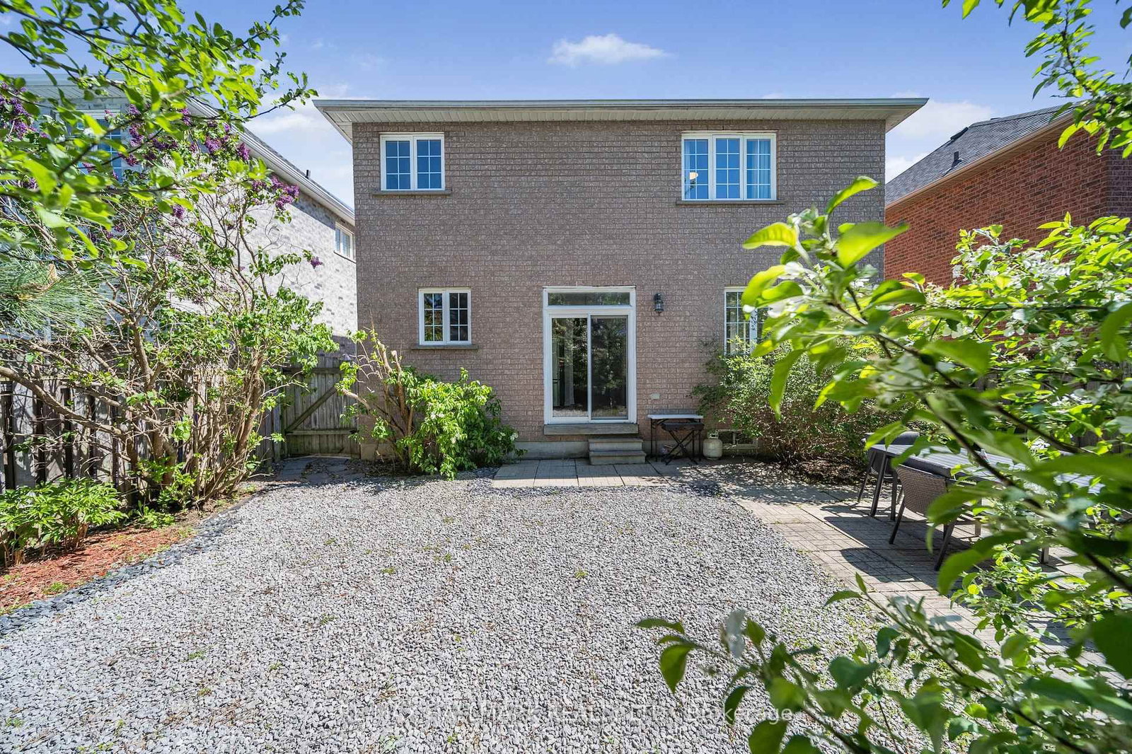 A yard laid in stone, not lawn