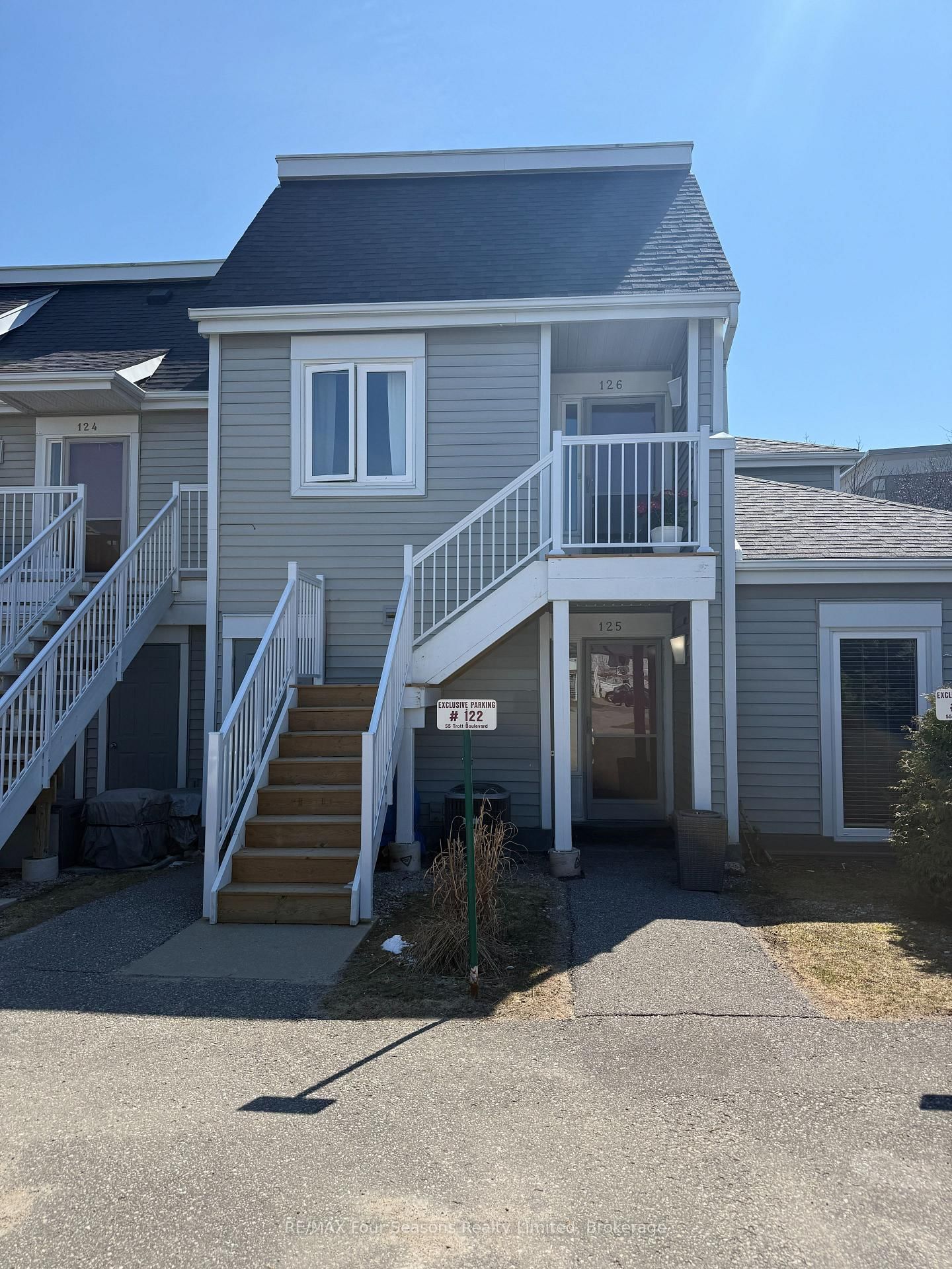 Turnkey Summer Rental in Harbourside - Loft-Style Condo Near Georgian Bay. Enjoy summer living in this bright and updated 2-bedroom, 2-bath loft-style condo located in a great location in Collingwood's west end. Fully furnished and move-in ready-just bring your personal items and settle in for the season. The open-concept main floor features vaulted ceilings with a sleek modern kitchen with stone countertops, hardwood flooring, and a sun-filled living area with large windows and a walkout to a spacious private deck. Ideal for relaxing or entertaining. The unit offers excellent natural light and a comfortable, functional layout. The upper-level loft primary suite includes an ensuite bath with soaker tub, and in-suite laundry. A second bedroom and full bathroom on the main level provide additional space for guests or family. Set within a well-established community, this property offers access to walking trails leading to the Georgian Bay waterfront and connects to Collingwood's extensive trail system-perfect for walking and biking. Cranberry Mews is located across the street with restaurants, a bakery, and local shops for everyday convenience. Sunset Beach and Northwinds Beach are a short drive away, along with Blue Mountain Village. This location is Ideally situated to explore the surrounding area, including Thornbury, Wasaga Beach, Creemore, and Meaford, all within a 10-20 minute drive. A great opportunity to explore our area. Includes one surface parking space,  1 visitor parking pass, and exterior storage locker. Available as a 3-month summer rental. Utilities extra. 50% deposit required with accepted lease, balance due 3 weeks prior to occupancy. $2,500 security deposit to be applied toward utilities and final cleaning. Come tour this property yourself, or ask for a virtual walkthrough.