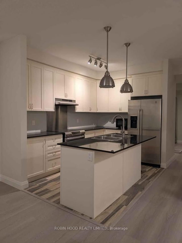 11 - 2220 Queensway Drive