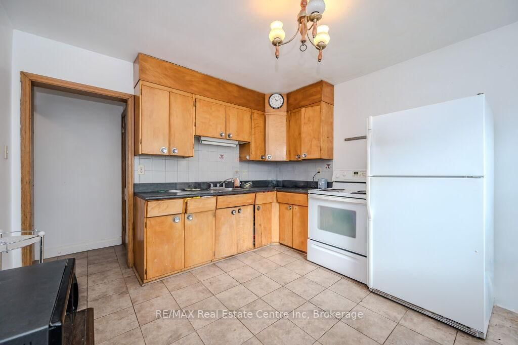 Detached House sold at 113 Elizabeth Street, Guelph, St. Patrick's Ward, N1E 2X4 - MLS: X12102480