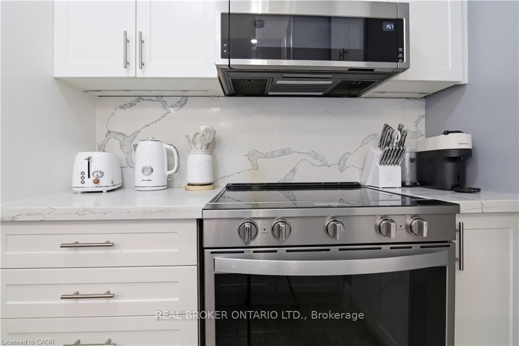 Townhouse for sale at 312 Humphrey Street, Hamilton, Ontario, L0R 2H1 - Waterdown - MLS: X12916600