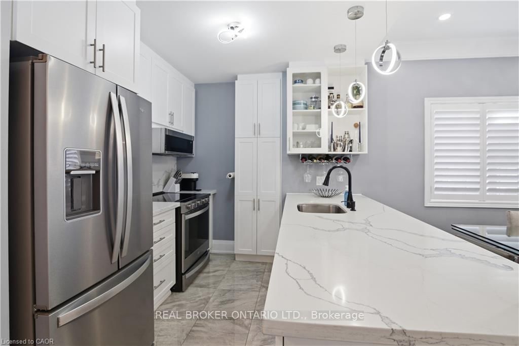 Townhouse for sale at 312 Humphrey Street, Hamilton, Ontario, L0R 2H1 - Waterdown - MLS: X12916600