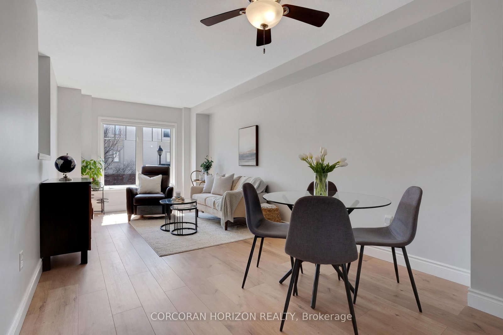 This beautifully upgraded and stylish 3-bedroom, 2-bathroom townhome offers a private garage, driveway parking, and plenty of visitor parking. This home is ideal for both everyday living and entertaining. As you step inside, the first thing you'll notice is the stunning upgraded wood stairs and elegant flooring that flow throughout the home. The kitchen is filled with natural light and offers plenty of space for an eat-in table-perfect for family meals or hosting guests. Step right onto your upper deck, the perfect place for your morning coffee, soaking up the sun, or enjoying outdoor dining. This main level also features a spacious living area with room for a formal dining setup, if desired. The flexible layout allows you to truly customize the space to suit your needs. Upstairs, you'll find three generously sized bedrooms. The primary suite includes a large walk-in closet, offering plenty of storage. The lower level is fully finished, providing an expansive bonus space perfect for a family room, home office, or recreation area. Sliding doors allow in tons of natural sunlight and lead out to the backyard patio and outdoor space-ideal for giving kids or pets room to play. This family-friendly townhouse complex includes a children's play area, making it a great option for growing families. Located just minutes from schools, parks, shopping, and dining, you can enjoy walking to local favorites like the Wavemaker Brewery or exploring the local farmers market in the summer. With easy access to Highway 401 and everything you need close by, this home offers the perfect combination of location and lifestyle. Don't miss this opportunity to make it yours!