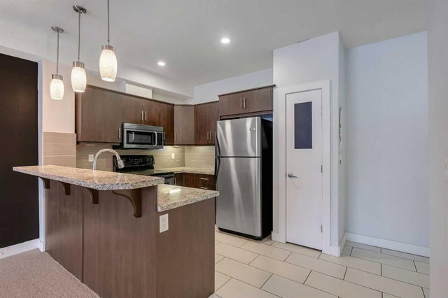 105 - 320 12 Avenue NE