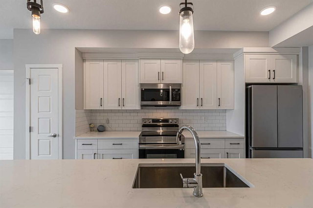 203 - 360 Harvest Hills Way NE