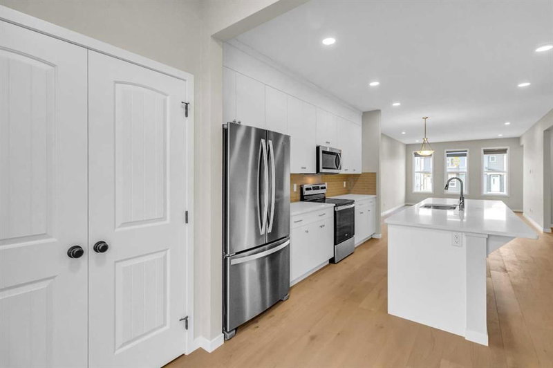 Semi Detached (Half Duplex) at 249 Aquila Drive NW, Glacier Ridge — listing photo