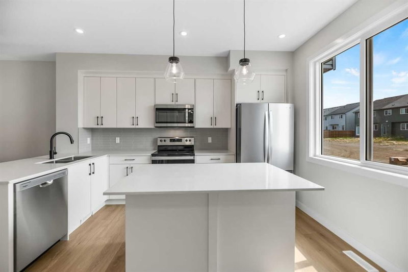 Row/Townhouse at 17 Savanna Place NE, Saddle Ridge — listing photo