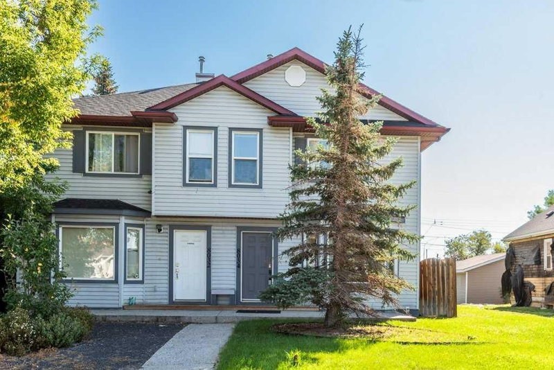 Semi Detached (Half Duplex) at 8034 24 Street SE, Ogden — listing photo