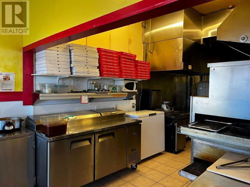 Image #1 of Restaurant for Sale at Canadian Pizza 212d 2 Street, Brooks, Alberta