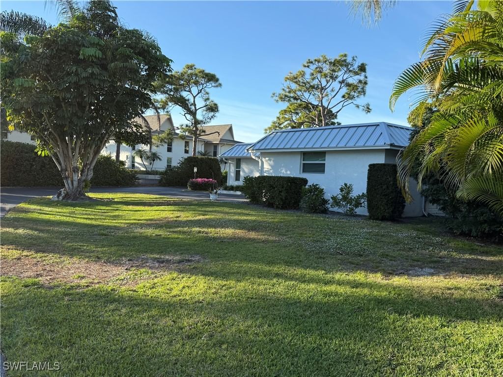 310 Carnaby Court, Naples, FL 34112 photo 2