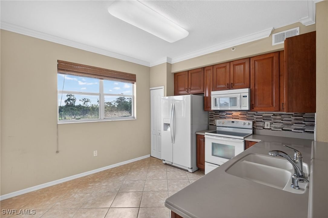6816 STERLING GREENS Place #303, Naples, FL 34104 photo 3