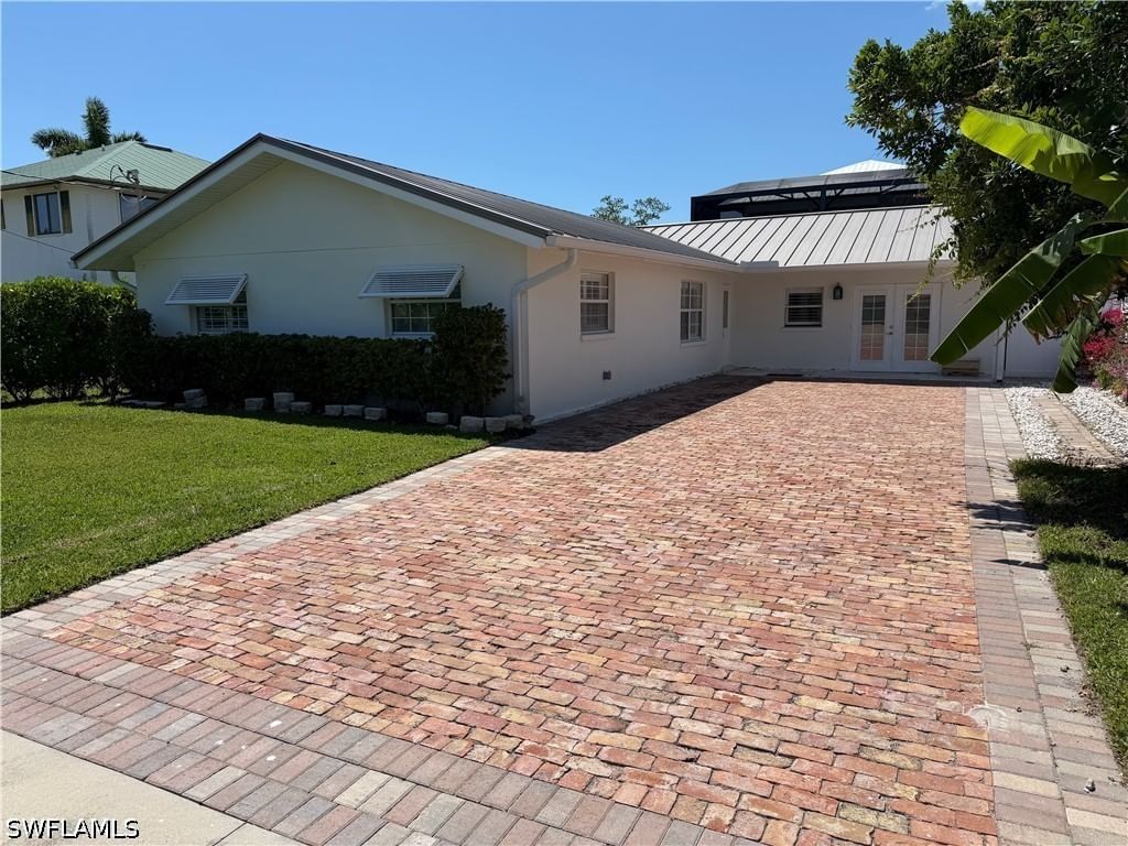 112 Capri Boulevard, Naples, FL 34113 photo 2
