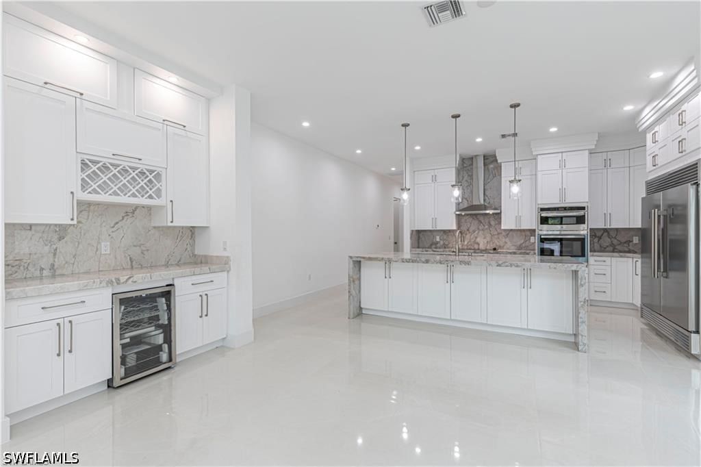 3098 Pine Tree Drive, Naples, FL 34112 photo 5