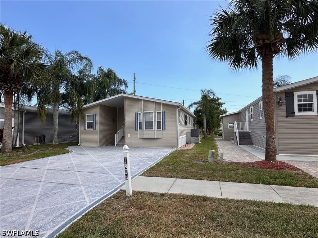 1307 Silver Lakes Boulevard, Naples, FL 34114 photo 2