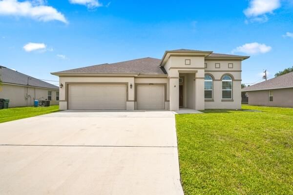 1957 SW LOGAN Street, Port St Lucie, FL 34953 photo 2