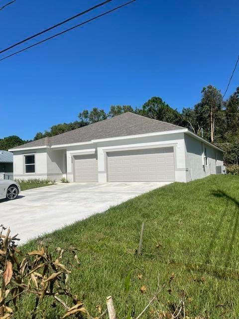 4958 NW FLINTSTONE Avenue, Port St Lucie, FL 34983 photo 2