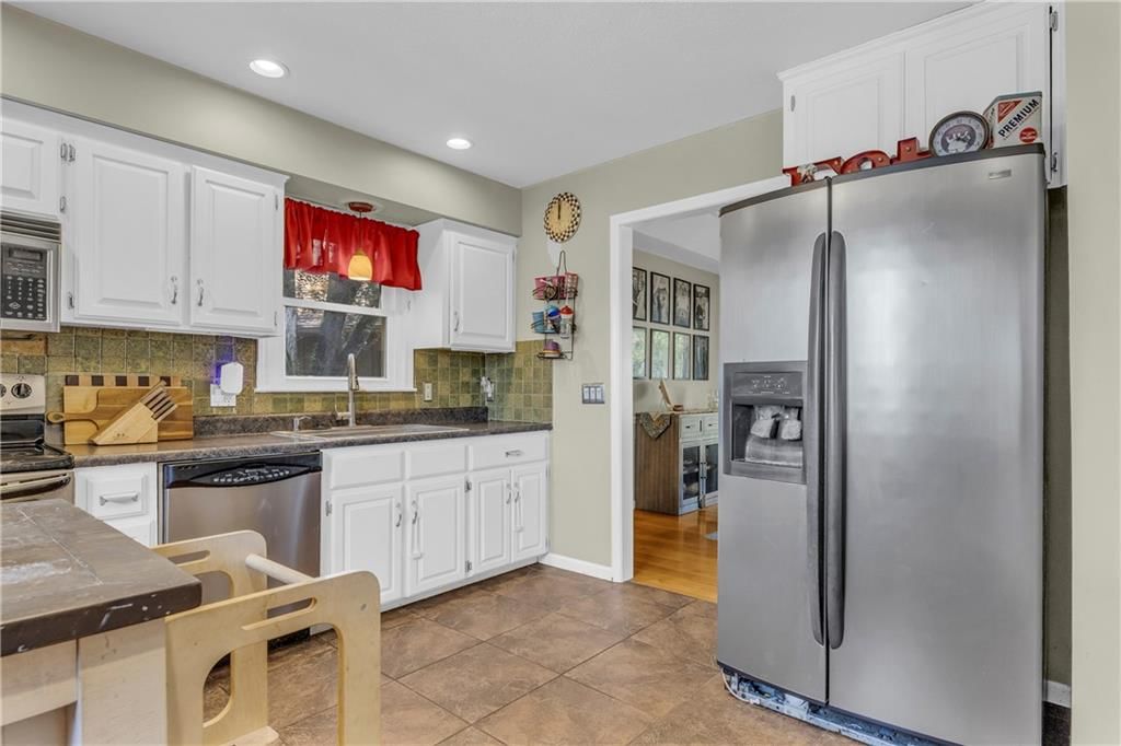 5501 NW Clubhouse Cove — photo 7