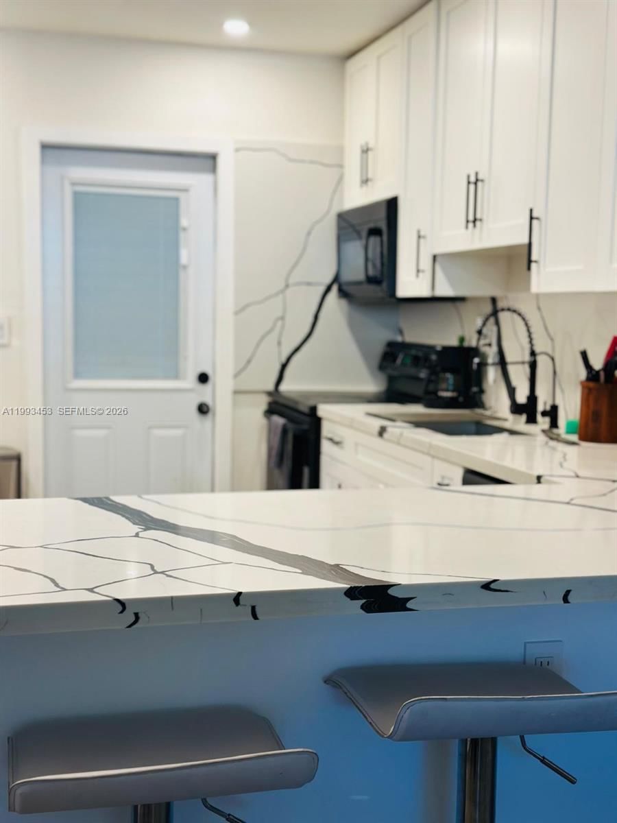 1002 NE 119TH ST, Unit F - 1