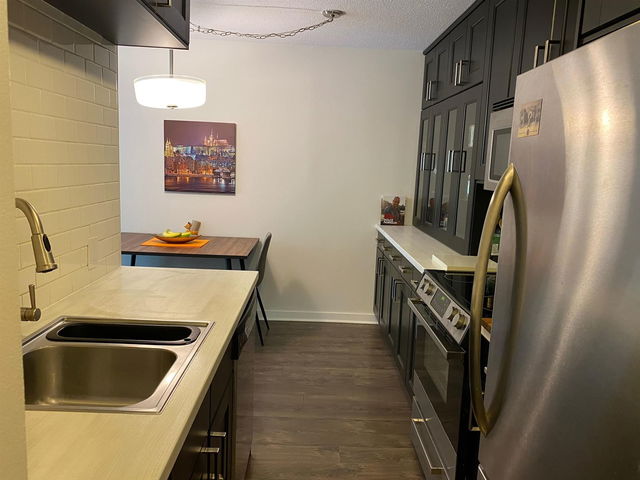 218 - 750 7th Avenue