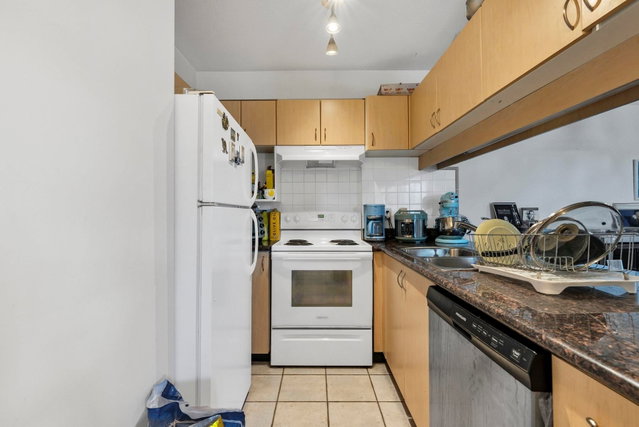 910 - 6611 Cooney Road