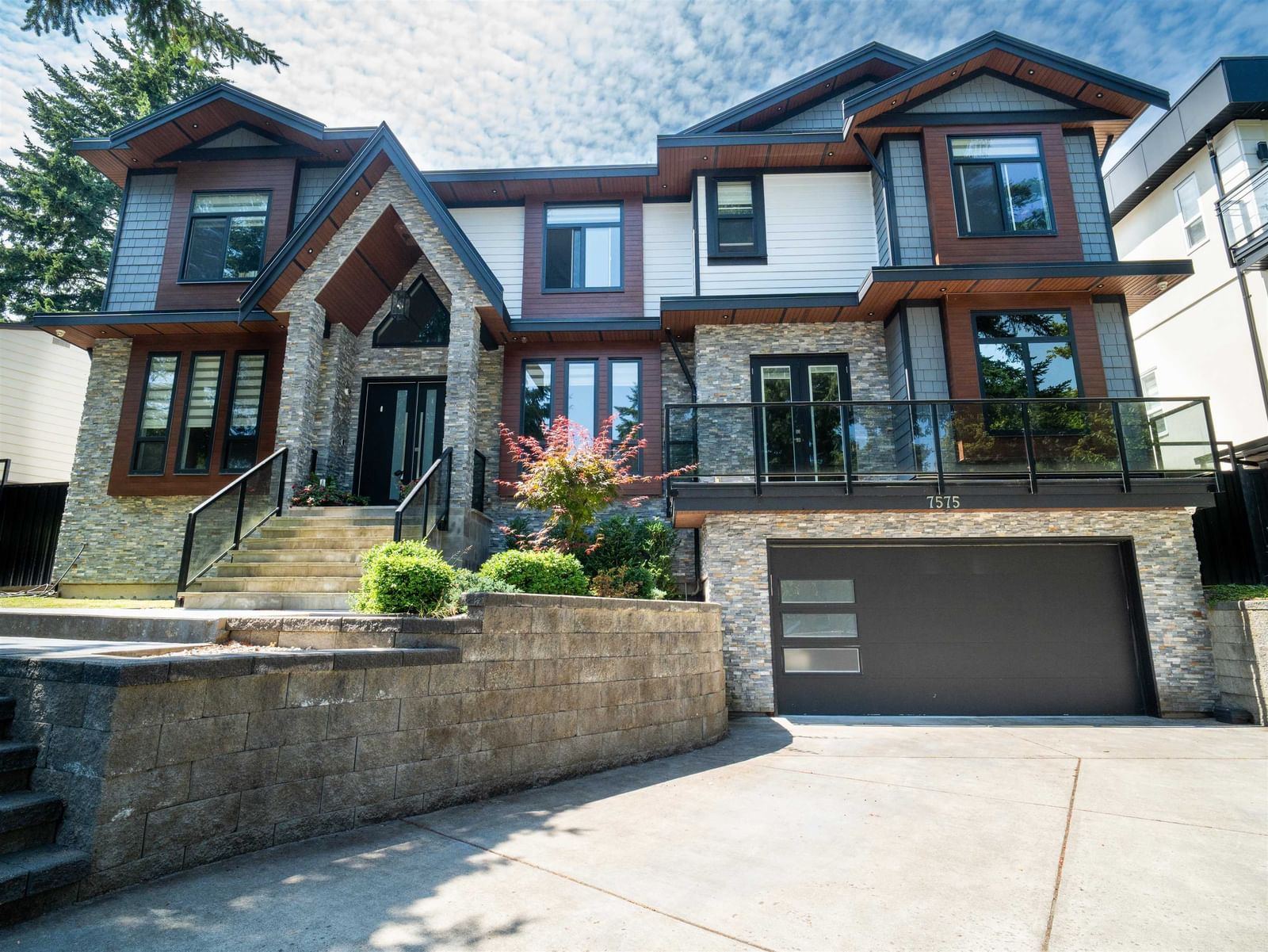 8 bedroom Single Family Residence exterior view at 7575 143 Street, East Newton - 5867 sq ft property built in 2019