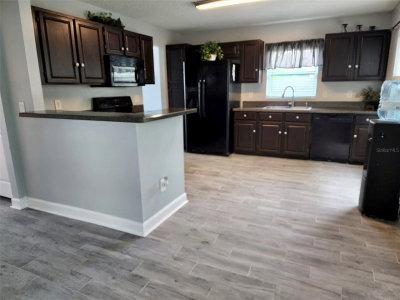 8070 VILLAGE GREEN Road, Orlando, FL, 32818 — photo 2