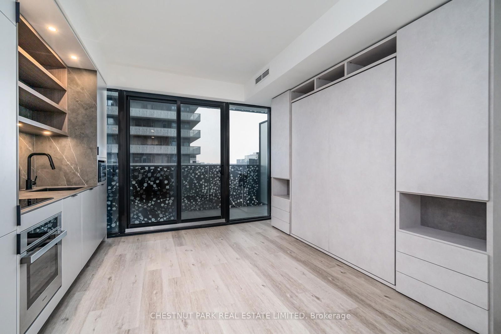 Welcome to this stunning studio suite, nestled in the coveted Bloor Yorkville Residences. This brand-new, never-before-lived-in space offers the perfect blend of luxury and functionality. The standout feature is the exquisite top-of-the-line Murphy bed, seamlessly integrated with custom-built closets and storage shelves, creating an organized and spacious environment. Effortlessly pull down the bed when needed, and tuck it away to enjoy the expansive living area when guests are present. The sleek, modern kitchen is equipped with premium appliances and ample pantry space, ensuring a delightful experience whether you're cooking or entertaining. Step out onto the large balcony from the living areaan ideal spot to unwind and soak in the vibrant cityscape, especially during warmer months. The airy three-piece bathroom provides a tranquil retreat, exuding a calm atmosphere that invites relaxation after a busy day. Throughout the suite, abundant storage solutions cater to your every need, making it the perfect residence for busy professionals or as an elegant pied--terre in the heart of the city. Comes with 1 Locker! **EXTRAS** Ideal for Triple A tenant or executive!