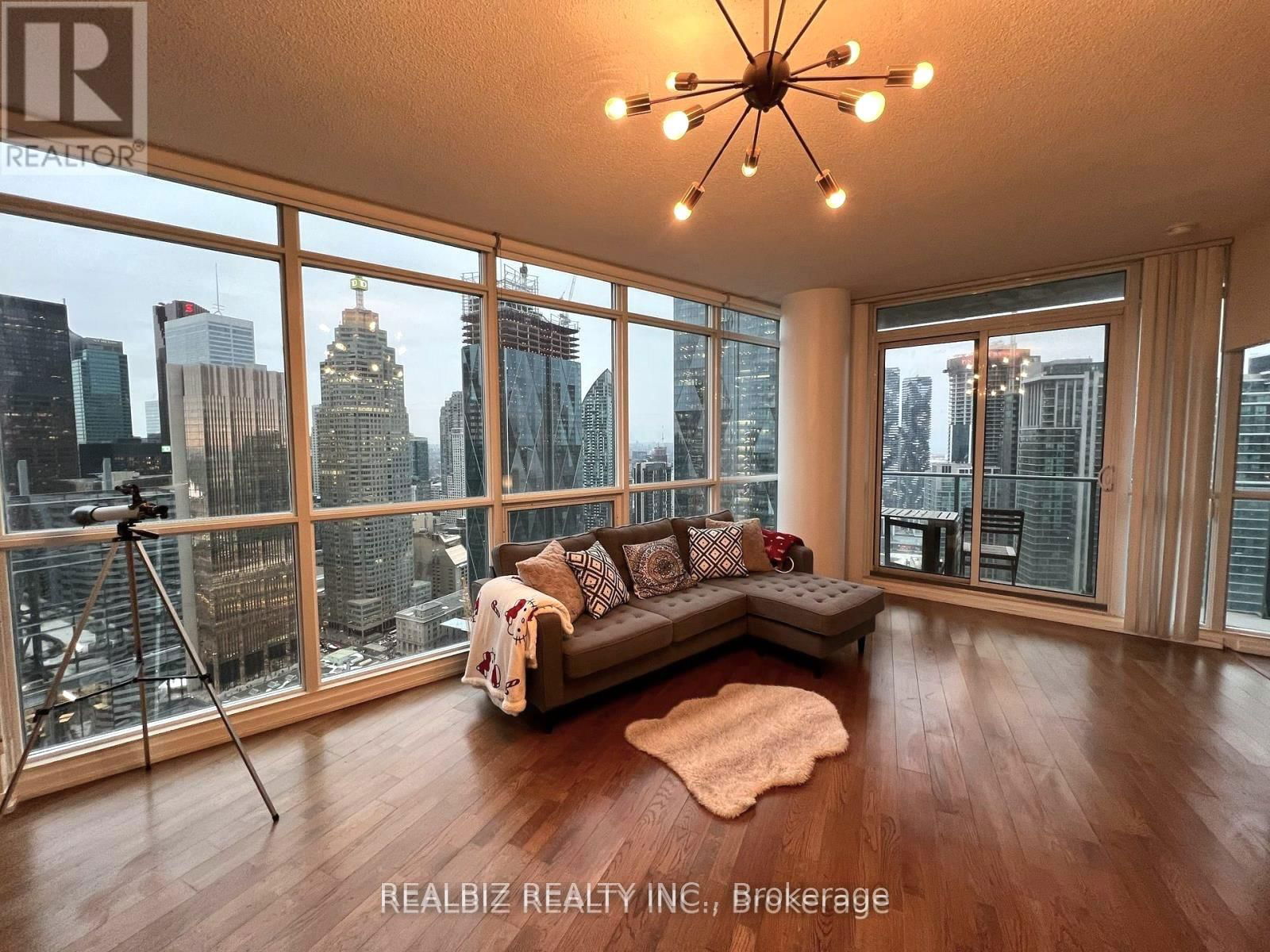 Fully furnished corner unit with breathtaking city and lake views! This bright and functional 2+Den features 9-foot ceilings, an open balcony, and a modern open-concept kitchen with stainless steel appliances and granite counters. Located in the highly sought-after Maple Leaf Square, enjoy direct access to Union Station and all downtown amenities. Steps from CN Tower, Scotiabank Arena, Gardiner Expressway, parks, and the waterfront. Experience luxury hotel-style amenities, including a gym, indoor/outdoor pool, rooftop garden, party room, guest suites, and more!