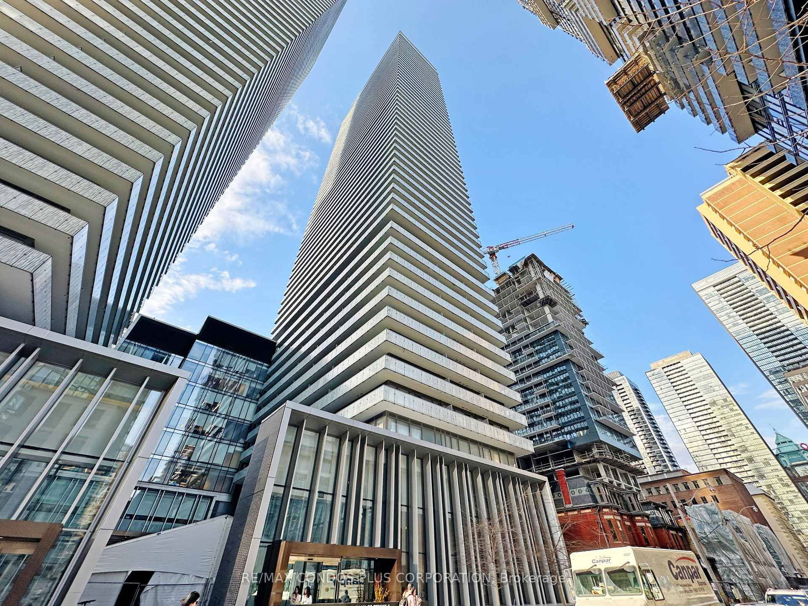 Experience luxurious living in the prestigious Yonge & Bloor Yorkville neighborhood. This bright and spacious 2-bedroom corner unit features a split-plan layout, soaring 9-foot ceilings, and breathtaking city views. Enjoy a wrap-around balcony perfect for relaxation. Floor-to-ceiling windows flood the living, dining, kitchen, and both bedrooms with natural light. Ideally situated just steps from Yorkville, Bloor Street shops, U of T, TMU, the DVP, and two subway lines for unparalleled convenience. Furnished unit. Heat and water included. Hydro extra.