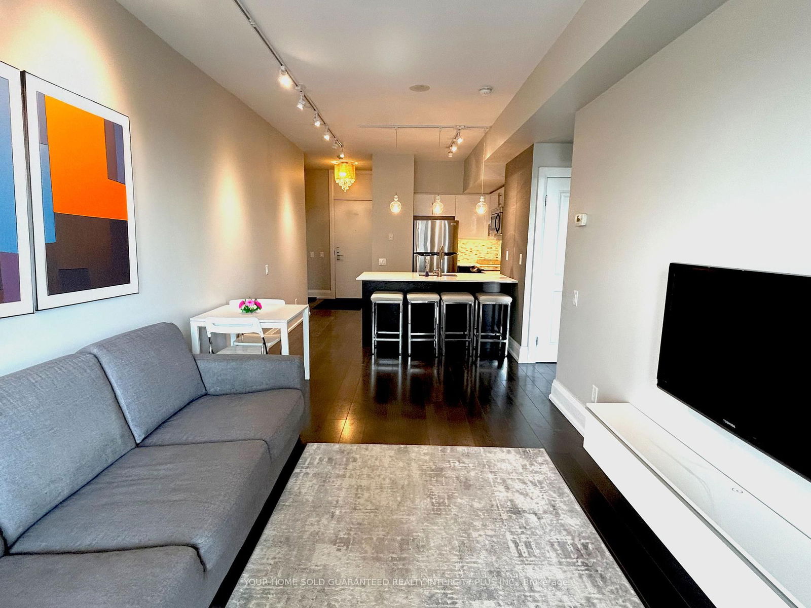 Partially Furnished, Southern Exposure Unit. This 1 Bedroom & Den Is A Must See. Spacious & Well Designed + Quality Finishing's & Upgrades, Includes 9Ft Ceilings, Dark Wide Plank Laminate Flooring, Under-mounted Square Sink, Backsplash, Upgraded Light Fixtures, Smooth Ceiling, Upgraded Trim, Casing & Doors, Closet Organizer, Pot Lights in Bedroom & Extended Quartz Countertop. Features 2 Walk-outs to a 20x6 Balcony. Amenities include A Roof Top Patio, Theatre Room and Basketball Court. Contact Listing Agent For Showings.