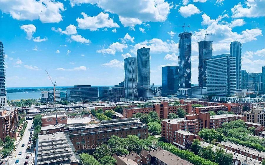Welcome to St. Lawrence Condos! Located in the heart of St. Lawrence Market. This Sleek Open Concept One Bedroom + DEN Unit Has Floor-To-Ceiling Windows With Unobstructed South Views Of The Lake & City Sky Line. It's Bright & Airy With 9Ft Ceilings. One Locker Included. **EXTRAS** Built-In Liebherr Fridge, Built-In Stainless Steel Cooktop, Oven, & Microwave. Stacked Washer & Dryer. All Existing Electric Light Fixtures. All Existing Window Coverings. A Commuter's Paradise! Walk To Union Station, St. Lawrence Market, Financial District, George Brown College, Shops, Restaurants, & More!