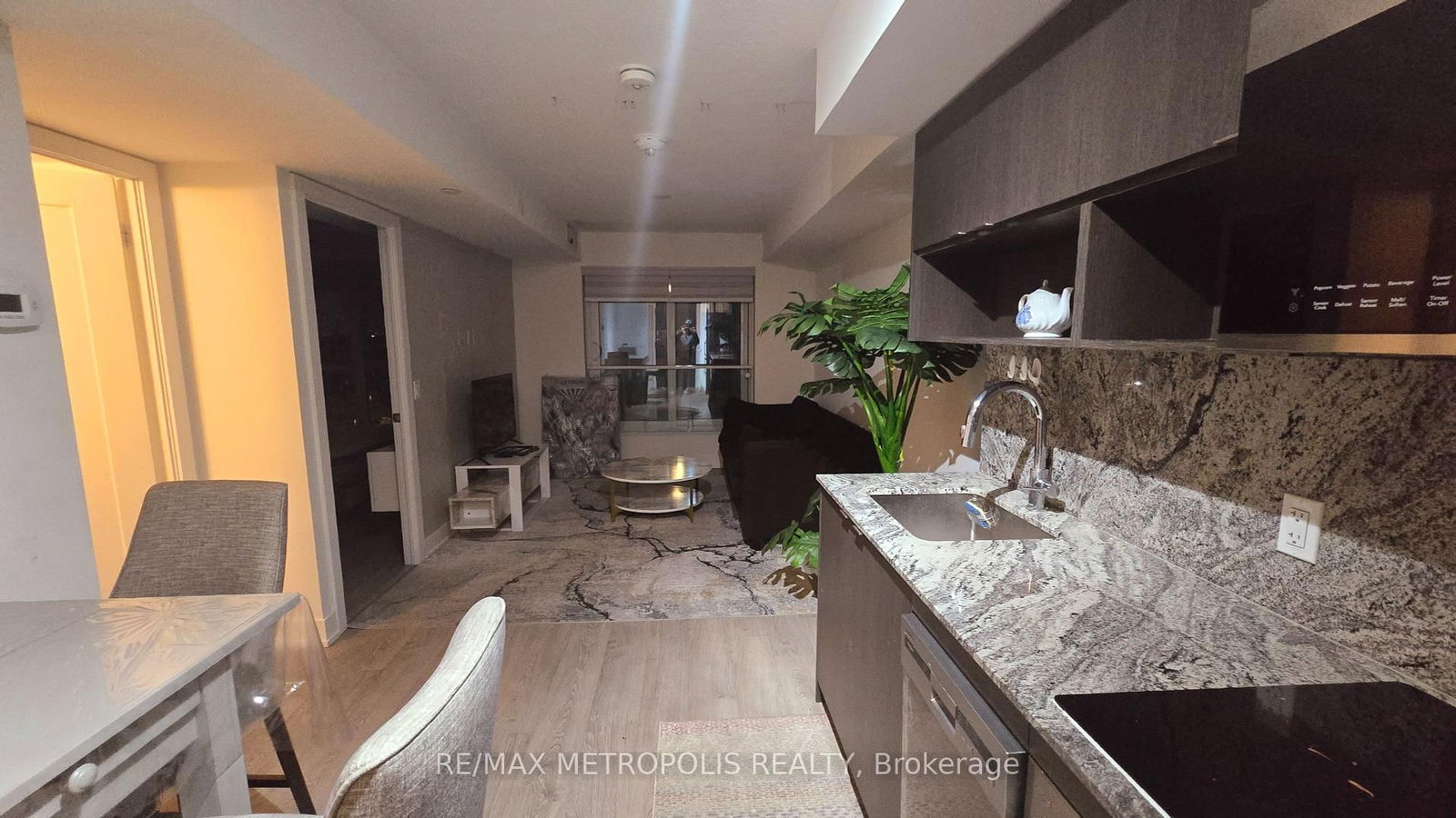 Welcome to Tridel's latest condo development, ideally located in the heart of Etobicoke, just a short walk from Islington Subway. This fairly new one-bedroom, one-bathroom unit includes a private parking space and features sleek laminate flooring throughout. Enjoy a Juliette balcony with an east-facing view, plus the convenience of ensuite laundry. The kitchen boasts premium stainless steel appliances, granite countertops, and a stylish backsplash. Take advantage of outstanding building amenities and a prime location close to numerous conveniences.