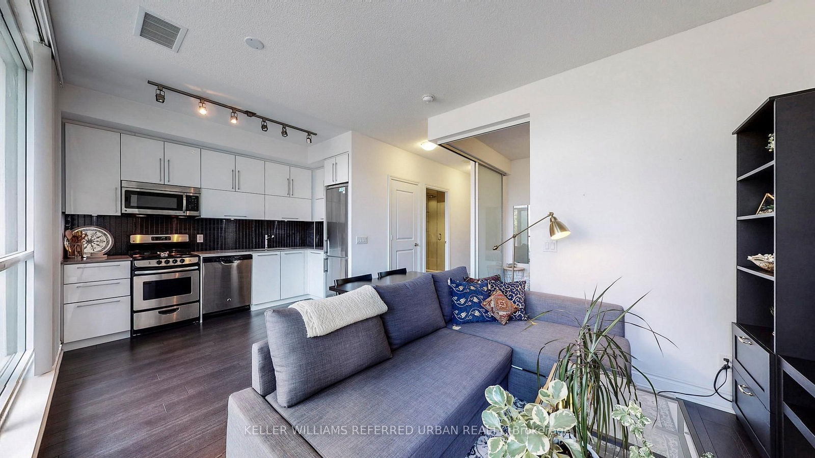 You want waterfront views and city energy? Boom-- this condo gives you both. Steps from the Martin Goodman Trail, 15 minutes to downtown, and packed with everything you need for next-level urban living. Sleek laminate floors? Check. A gourmet kitchen with stainless steel appliances? Of course. A spa-inspired bath and an oversized private balcony made for golden hour? You bet. But here's the kicker-- a rooftop terrace with insane skyline and lake views. TTC at your door, quick access to highways, top restaurants, bars, Metro, LCBO, and Shoppers just around the corner. This is style, convenience, and luxury wrapped into one. Don't miss out!