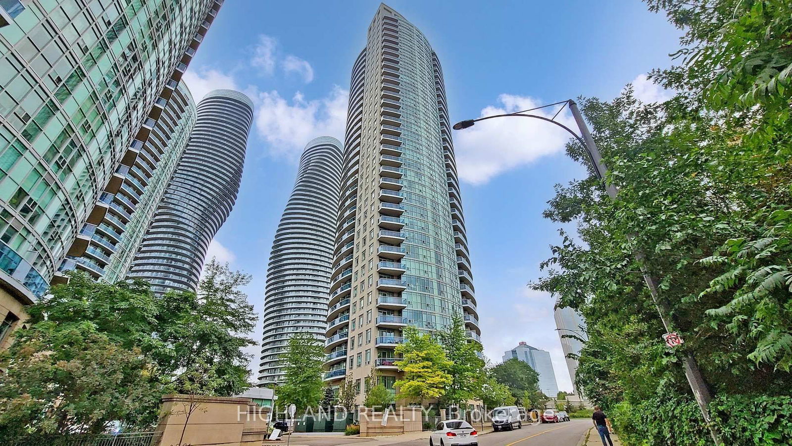 ** Brand New Laminate Floor & Professional Clean ** ** One Parking & One Locker Included ** Breathtaking Unobstructed View Condo (2 Bedrooms  & 2 Full Bathrooms) Located At Heart of The Mississauga - Hurontario & Burnhamthorpe. New Laminate Floor Through-Out Living, Dining & Bedrooms. Floor To Ceiling Large Windows, Spectacular Views Of The City, Modern Designed Kitchen With A Functional Peninsula. Steps To Square One Mall, Sheridan College, Central Library, Living Arts Centre, Ymca, Transportation, Hwys, 5 Star Amenities And Much More.