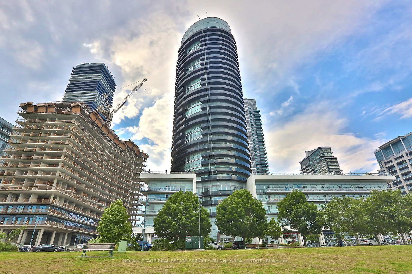 Live by the water in luscious Waterscapes Condo by Monarch. Distinctive features to this 2-bedroom 840sftunit include breakfast island with storage, private laundry room directly accessible by both bedrooms, terrace-sized balcony overlooking a beautifully landscaped courtyard and big enough for a dining table and garden. Convenient over-sized locker on same floor as unit and prime parking spot in underground garage. Upscale general amenities including hot tub in the building. Transit at your door, close to downtown Toronto, easy access to Gardiner, steps to the lake, Waterfront Trail, shops and cafes.