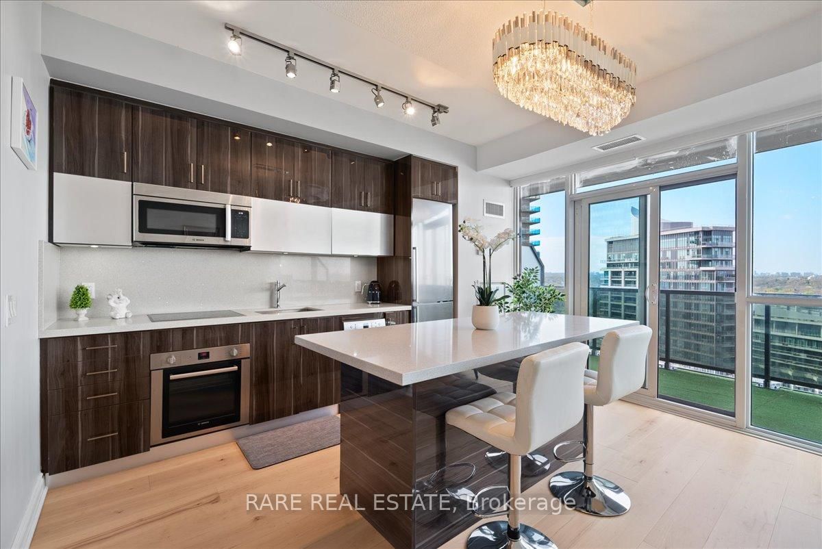 Indulge in luxury with this 1 bed 1 bath condo with parking in the heart of Humber Bay Shores waterfront. True pride of ownership shines through freshly upgraded floors, a striking chandelier, and an upgraded high-end kitchen. South-east facing windows flood the space with sunlight, complementing panoramic waterfront views of the CN Tower and Toronto skyline from the large balcony. Conveniently located near the Gardiner Expressway and all major arteries, it's a mere 15 minutes from both the airport and downtown Toronto. Enjoy proximity to Costco, Walmart, IKEA, Sherway Gardens, and grocery stores for added convenience!